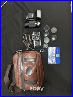 Vintage Olympus OM-10 35mm Camera with extra lens and accessories and bag
