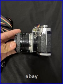 Vintage Olympus OM-10 35mm Camera with extra lens and accessories and bag