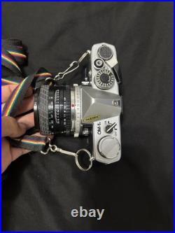 Vintage Olympus OM-10 35mm Camera with extra lens and accessories and bag