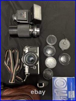 Vintage Olympus OM-10 35mm Camera with extra lens and accessories and bag