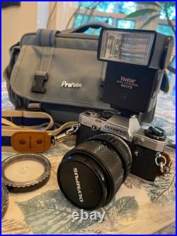 Vintage Olympus OM-10 SLR Camera With flash, 3 Lens, 2 Cases, lens hood & manual