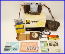 Vintage Ricoh 500 camera + telephoto lens + meter + Photrix meter etc