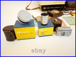 Vintage Ricoh 500 camera + telephoto lens + meter + Photrix meter etc