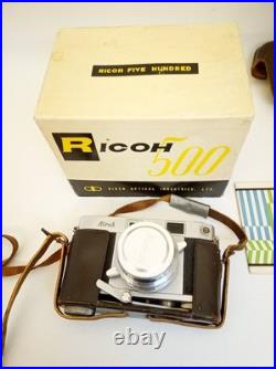 Vintage Ricoh 500 camera + telephoto lens + meter + Photrix meter etc