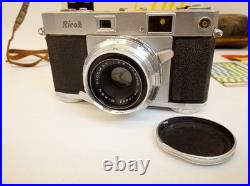 Vintage Ricoh 500 camera + telephoto lens + meter + Photrix meter etc