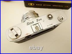 Vintage Ricoh 500 camera + telephoto lens + meter + Photrix meter etc