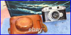 Vintage VOKAR II camera with Vokar 50 mm f/2.8 lens and case shelf display