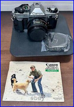 Vtg Canon AE-1 Program 35mm film SLR camera withCanon FD 50mm f/1.8 lens (lot b)