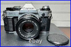 Vtg Canon AE-1 Program 35mm film SLR camera withCanon FD 50mm f/1.8 lens (lot b)